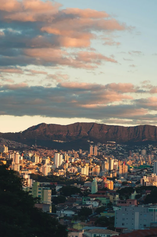 a view of a city from the top of a hill, by Elsa Bleda, pexels contest winner, quito school, golden hour cinematic, rio de janeiro, ultrawide landscape, split near the left