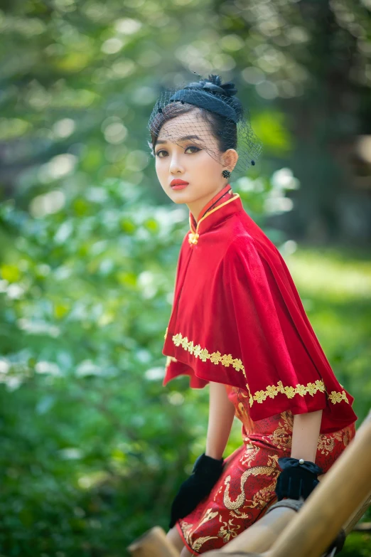 a woman sitting on top of a wooden bench, a portrait, inspired by Shang Xi, pexels contest winner, red and gold sumptuous garb, square, mai anh tran, slide show