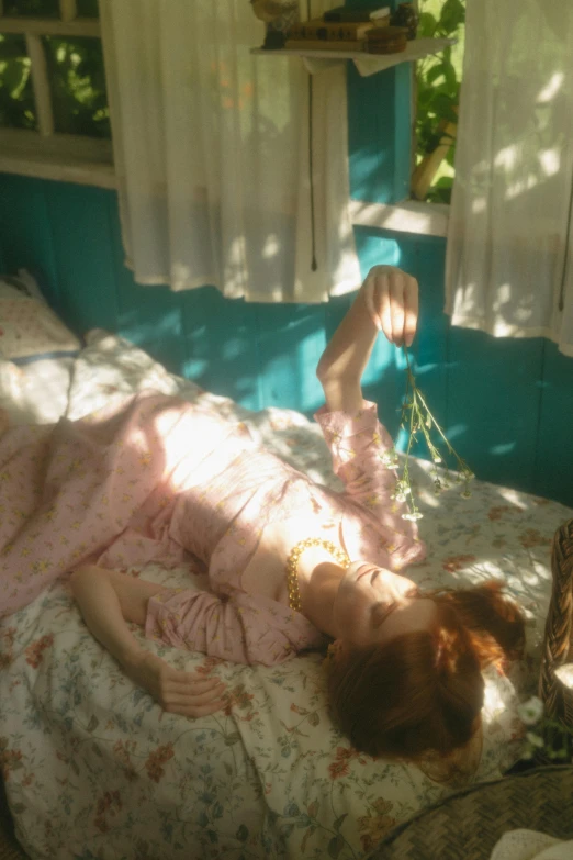 a little girl laying on top of a bed, an album cover, inspired by Elsa Bleda, unsplash, magic realism, sadie sink, summer sunlight, petra collins, in a tree house