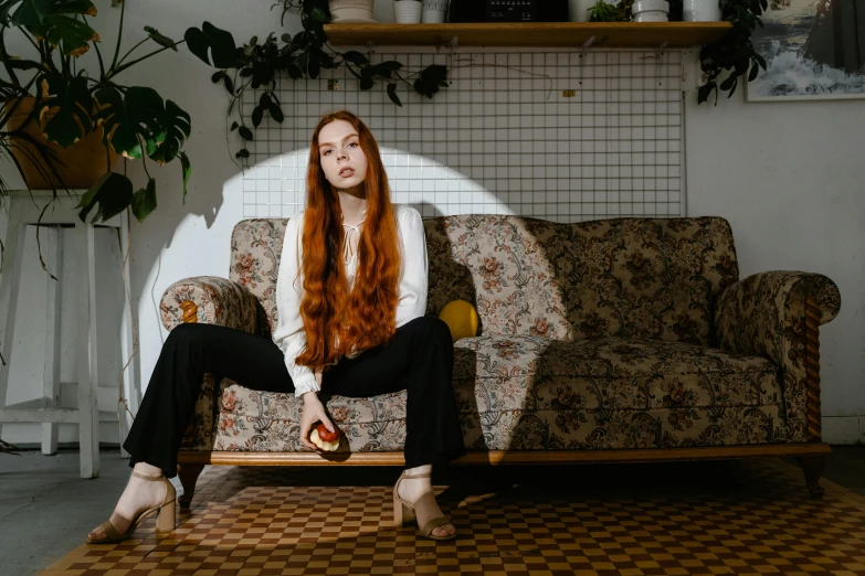 a woman with long red hair sitting on a couch, inspired by Elsa Bleda, pexels contest winner, standing in corner of room, angelina stroganova, carson ellis, 15081959 21121991 01012000 4k