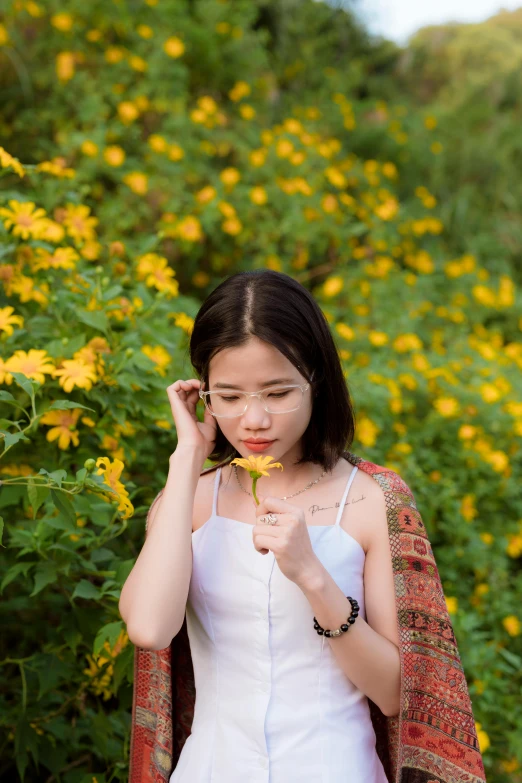 a woman standing in a field of yellow flowers, inspired by Xie Sun, pexels contest winner, young cute wan asian face, with white, quy ho, medium portrait soft light