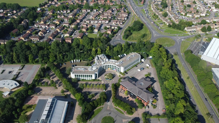 an aerial view of a city with lots of buildings, a photo, by Steve Prescott, elstree, three - quarter view, office, silver