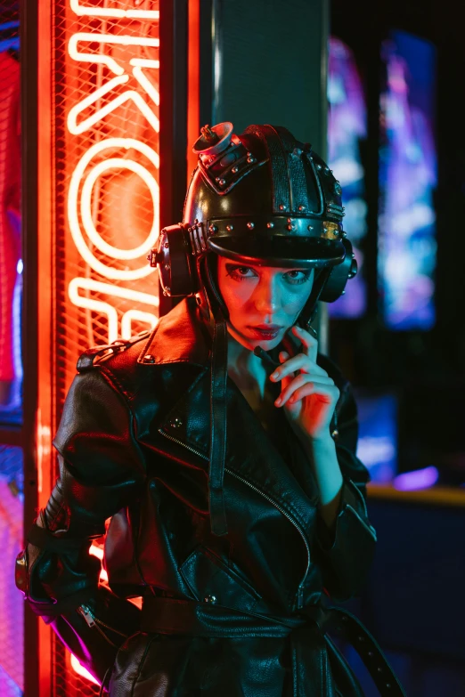 a woman wearing a helmet standing in front of a neon sign, cyberpunk art, leather pilots uniform, steam punk party, photograph of a techwear woman, trending at cgstation