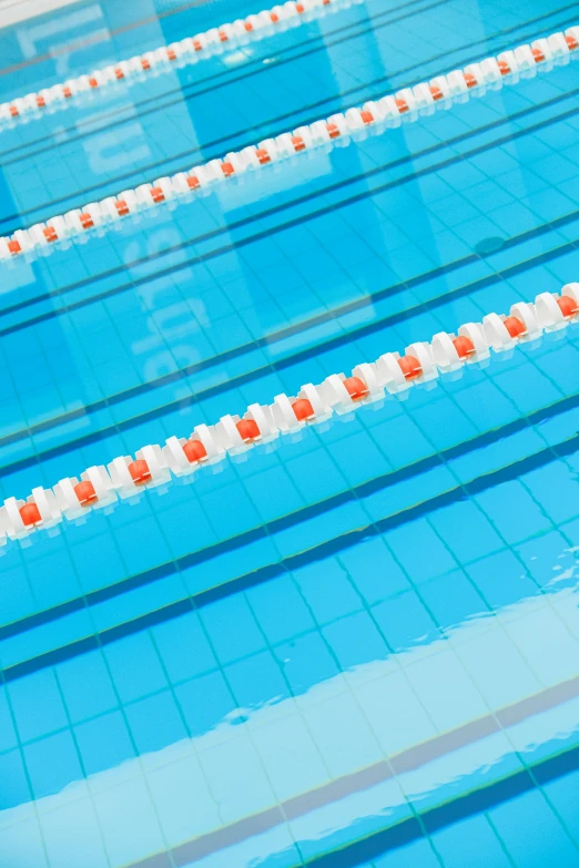 a swimming pool filled with lots of blue water, shutterstock, modernism, 2 5 6 x 2 5 6 pixels, sports setting, orange and white color scheme, detail shot