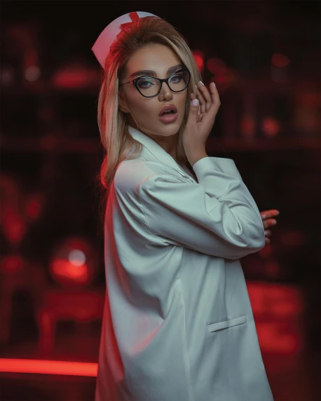 a woman in a white lab coat and glasses, by Emma Andijewska, trending on pexels, neo-romanticism, nightlife, candy girl, red light, grey robes
