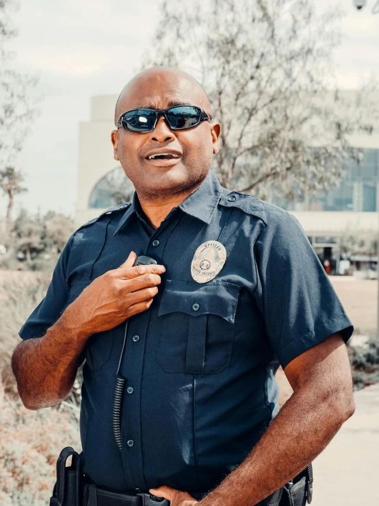 a man in a police uniform posing for a picture, unsplash, symbolism, 💣 💥💣 💥, los angeles ca, profile image, 2000s photo