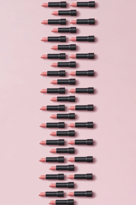 a row of lipsticks on a pink background, inspired by Vanessa Beecroft, photorealism, stacked, pastel', f / 2 0, light pink