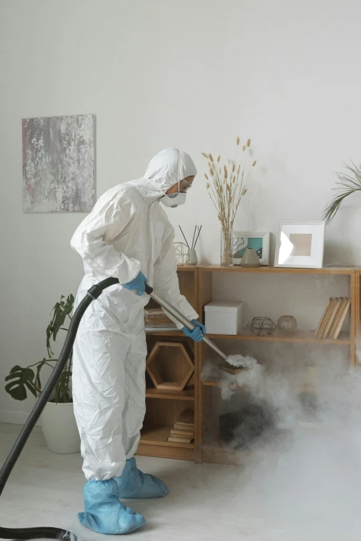 a person in a white suit is cleaning a room, dust in the air, wearing a robe, profile image, furniture