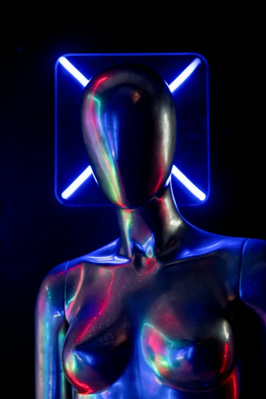 a close up of a mannequin in front of a neon sign, pexels contest winner, holography, chrome bodysuit, chrome face symmetry, on a mannequin. studio lighting, neon cross