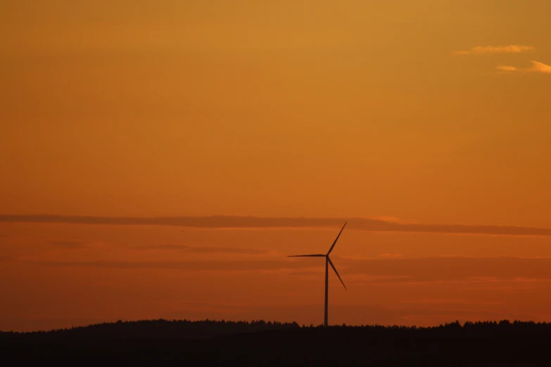 a couple of wind turbines sitting on top of a hill, by Mathias Kollros, hurufiyya, the colours of the sunset, portrait photo