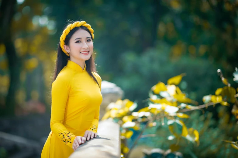 a woman in a yellow dress posing for a picture, a picture, inspired by Cui Bai, pexels contest winner, ao dai, background image, square, high quality upload