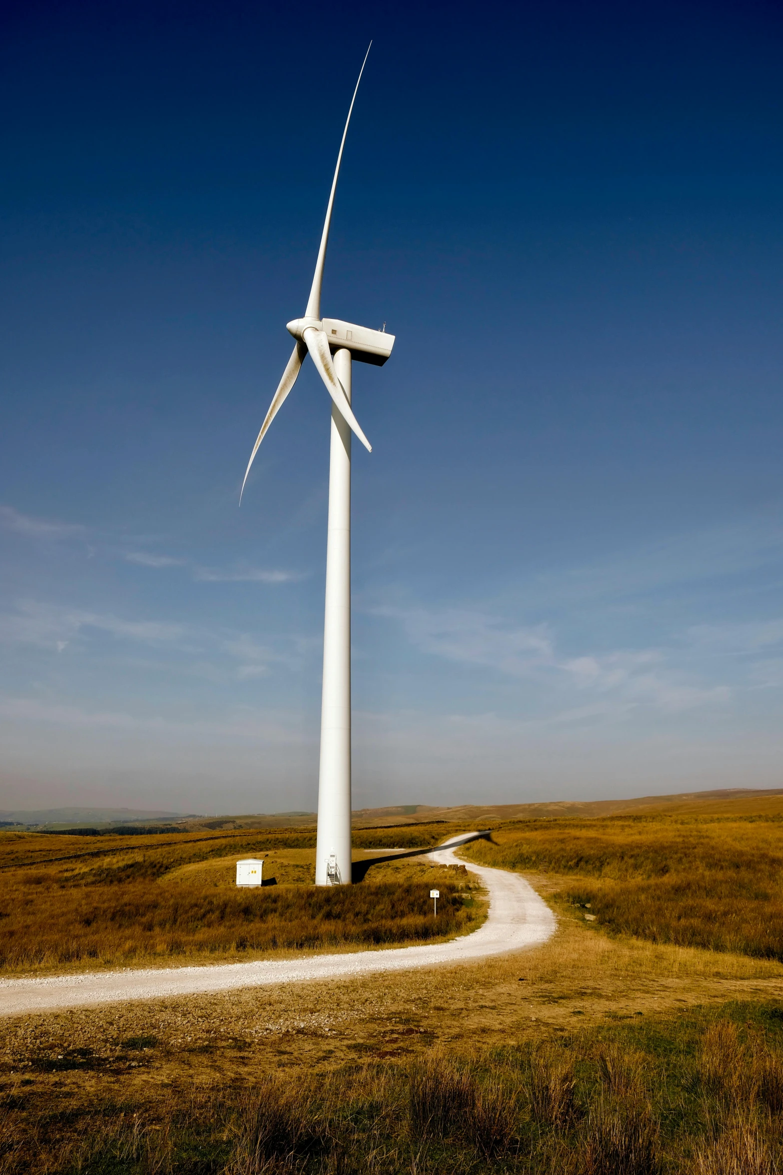 a wind turbine in the middle of a field, by Dan Scott, slide show, shap, large tall, exterior shot