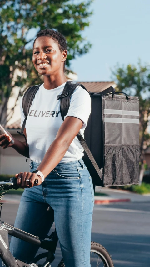 a woman riding a bike with a bag on the back, charcoal and silver color scheme, 🥥 🍕 hybrid, emergency, heavily upvoted