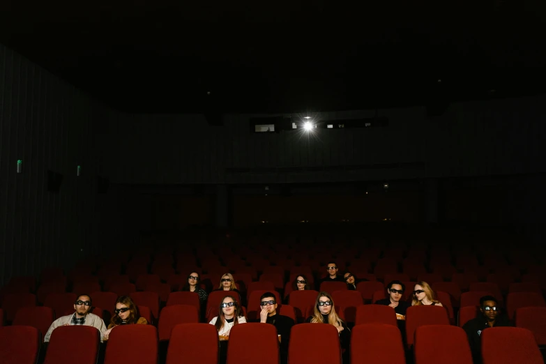 a group of people sitting in a movie theater, a picture, by Matthias Stom, pexels, video art, field of view, transparent background, multiple stories, photographed for reuters