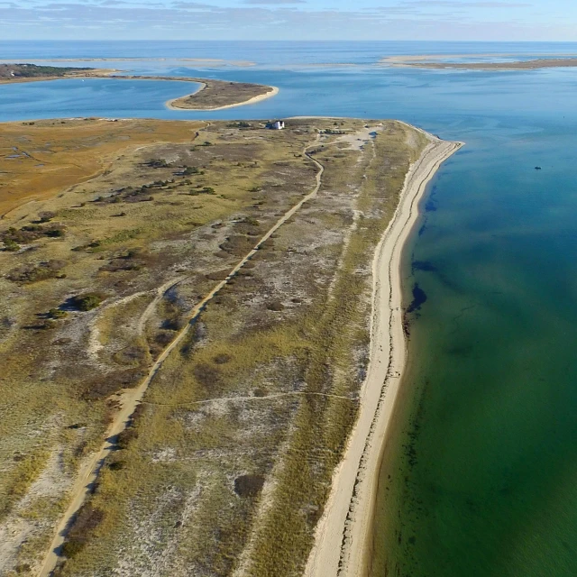 an aerial view of a beach and a body of water, by Thomas Crane, hziulquoigmnzhah, kimberly asstyn, water reservoir, cape