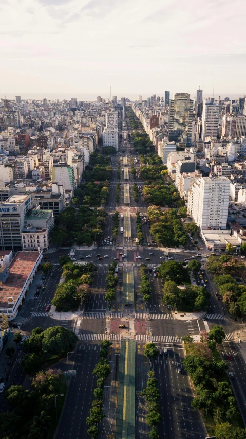 an aerial view of a city with tall buildings, by Ceferí Olivé, unsplash contest winner, art nouveau, argentina presidential rally, square, prefecture streets, 8 k hi - res