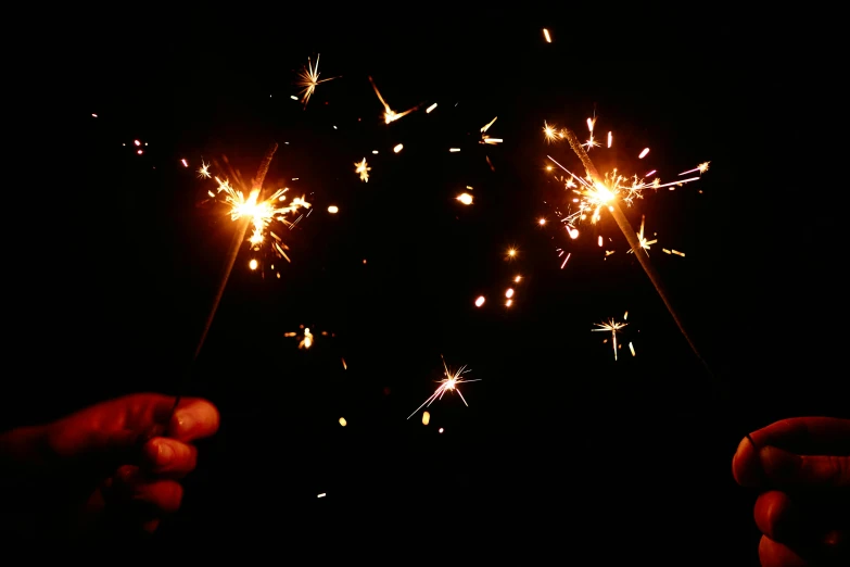 a person holding a sparkler in their hand, pexels, shining gold and black and red, instagram post, fire flies, aaaaaaaaaaaaaaaaaaaaaa