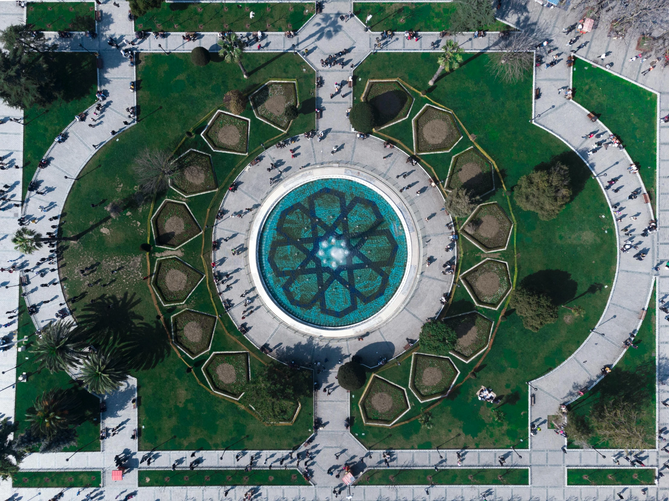 an aerial view of a park with a fountain, a mosaic, by Alejandro Obregón, pexels contest winner, everything enclosed in a circle, chile, los angeles ca, islamic