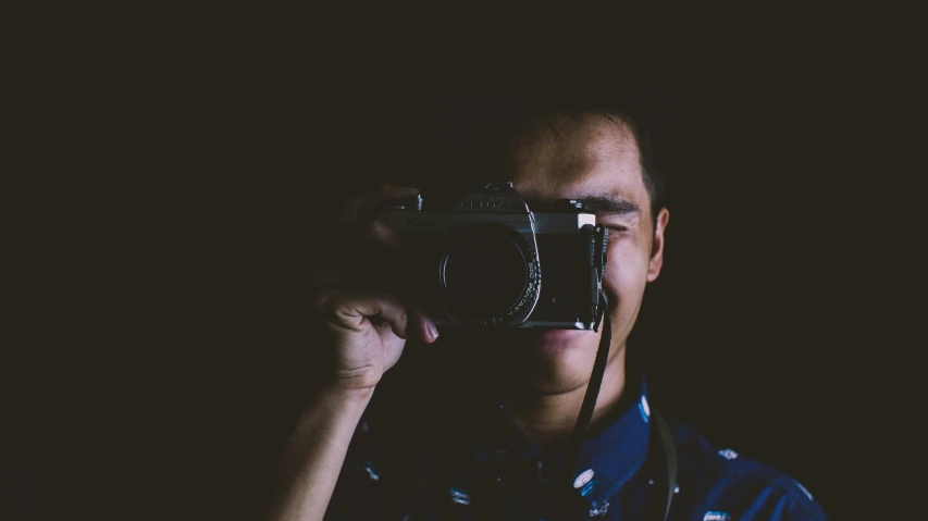 a man taking a picture with a camera, a picture, pexels contest winner, dark backround, avatar image, asian male, medium format