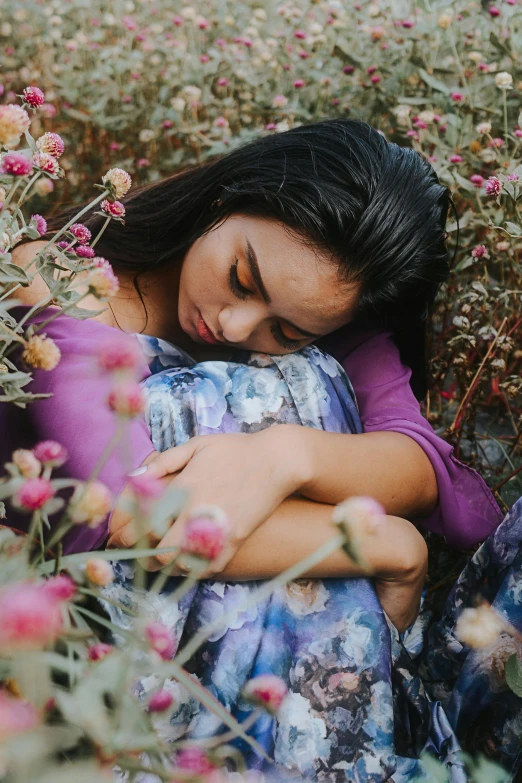 a woman laying down in a field of flowers, inspired by Elsa Bleda, pexels contest winner, he holds her while she sleeps, young himalayan woman, with soft bushes, multicoloured