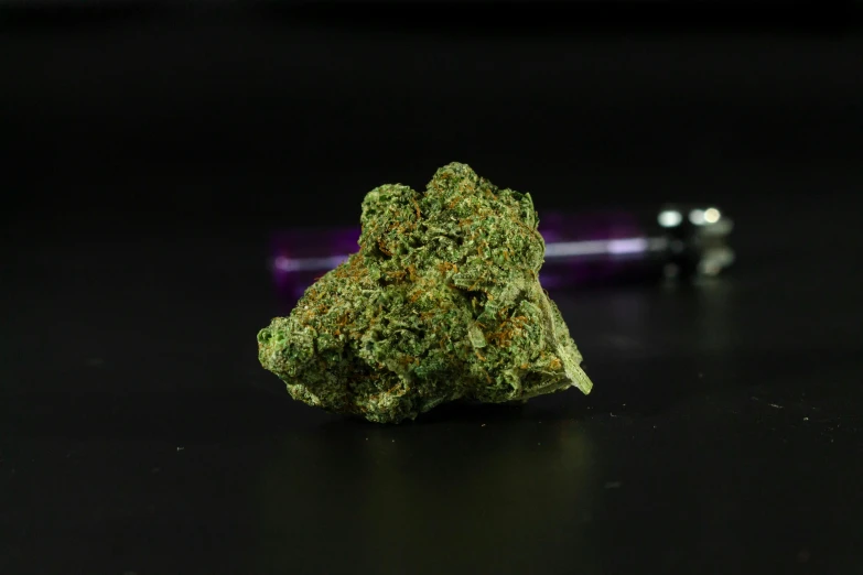 a piece of marijuana sitting on top of a table, purple and green, high quality product image”, professional result, sherbert sky