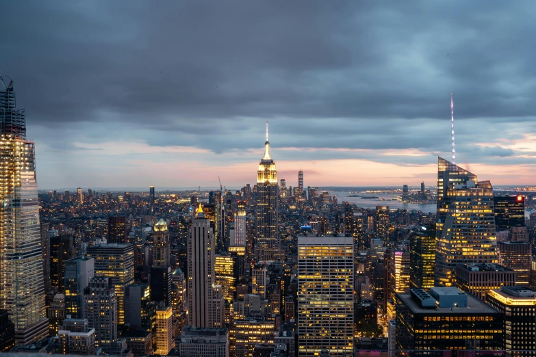 a view of a city from the top of a building, by Greg Rutkowski, pexels contest winner, renaissance, overcast dusk, empire state building, twilight skyline, 8k resolution”