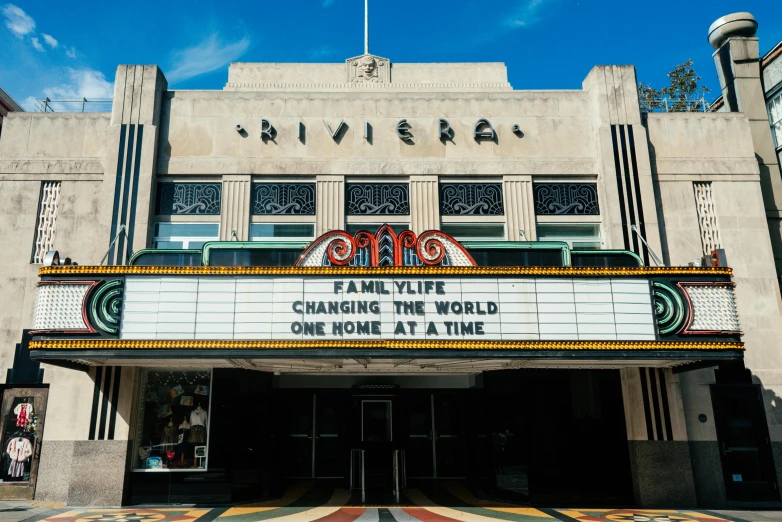 a theater marquee with a blue sky in the background, an album cover, the multiverse, riverside, thumbnail, university