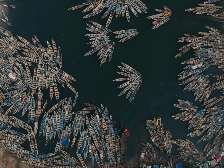 a large body of water filled with lots of boats, by Ibrahim Kodra, pexels contest winner, conceptual art, anthropological photography, flat lay, 8 k -, thumbnail