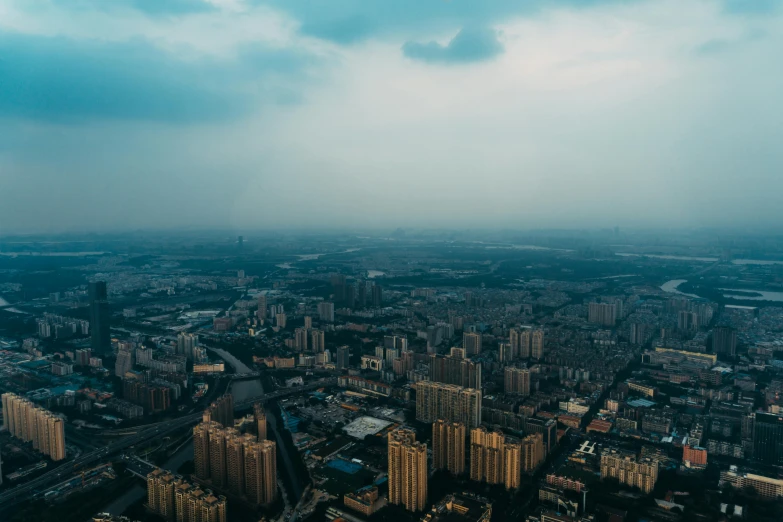 an aerial view of a city with tall buildings, pexels contest winner, visible sky and humid atmosphere, changquan, unsplash 4k, multiple stories