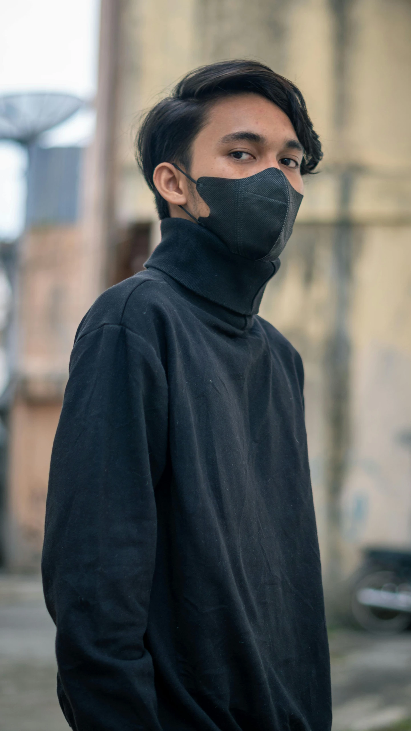 a young man wearing a black face mask, inspired by Kanō Naizen, unsplash contest winner, black turtle neck shirt, street clothes, high quality photo, dark. no text