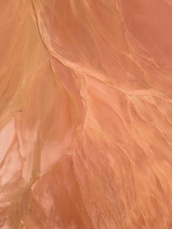 a man riding a snowboard down a snow covered slope, an ultrafine detailed painting, inspired by Christo, pexels contest winner, metaphysical painting, in shades of peach, shiny layered geological strata, closeup - view, wet clay