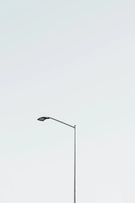 a traffic light sitting on the side of a road, by Holger Roed, postminimalism, square, streetlamp, minimal, cityscape