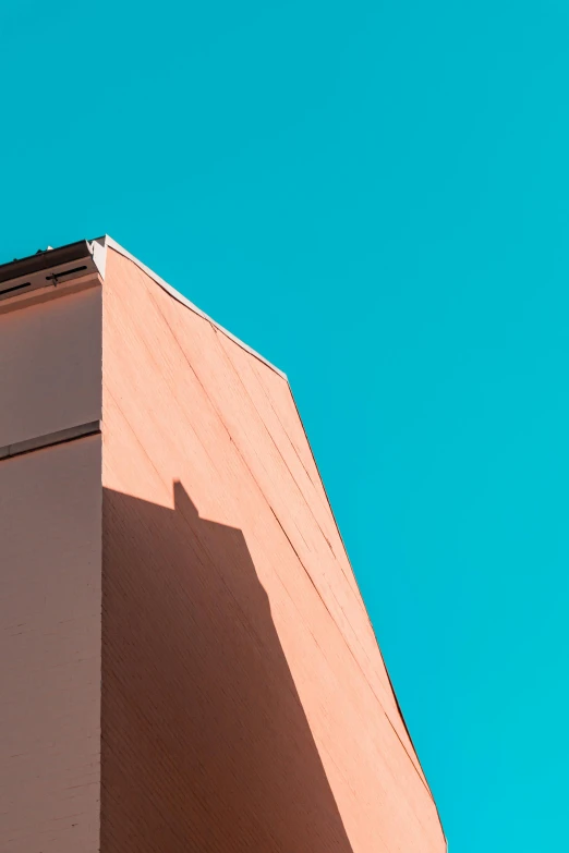 a clock that is on the side of a building, a photo, pexels contest winner, postminimalism, pink shadows, light blue clear sky, clemens ascher, sharp roofs