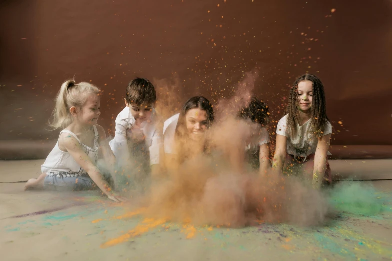 a group of children playing with colored powder, by Andries Stock, pexels contest winner, interactive art, brown colours, 15081959 21121991 01012000 4k, falling sand inside, decoration