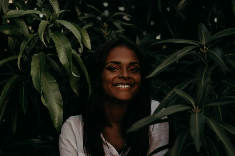a woman that is standing in front of some plants, pexels contest winner, hurufiyya, indian girl with brown skin, dimples, avatar image, sydney park