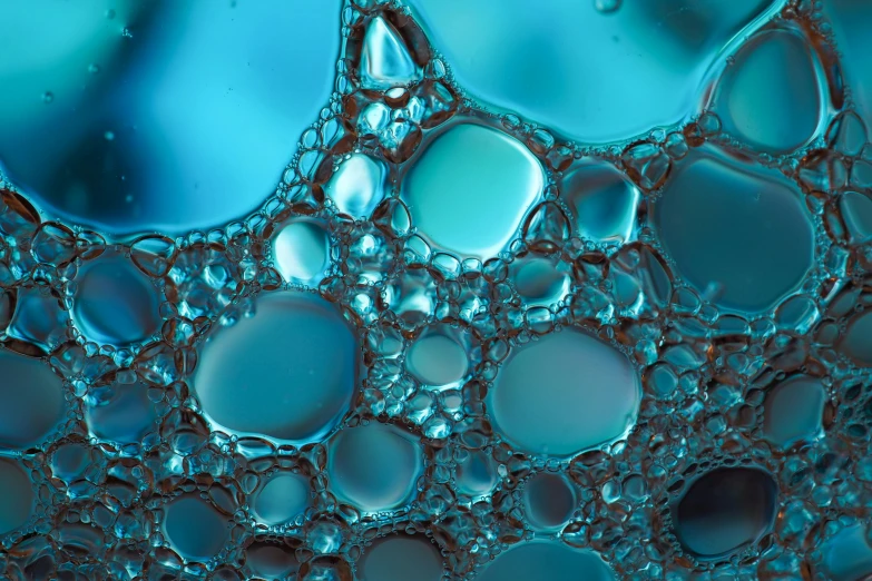 a close up of water bubbles on a blue surface, a microscopic photo, by Jacob Toorenvliet, unsplash, generative art, organic liquid metal, cell-shaded, panels, turqouise
