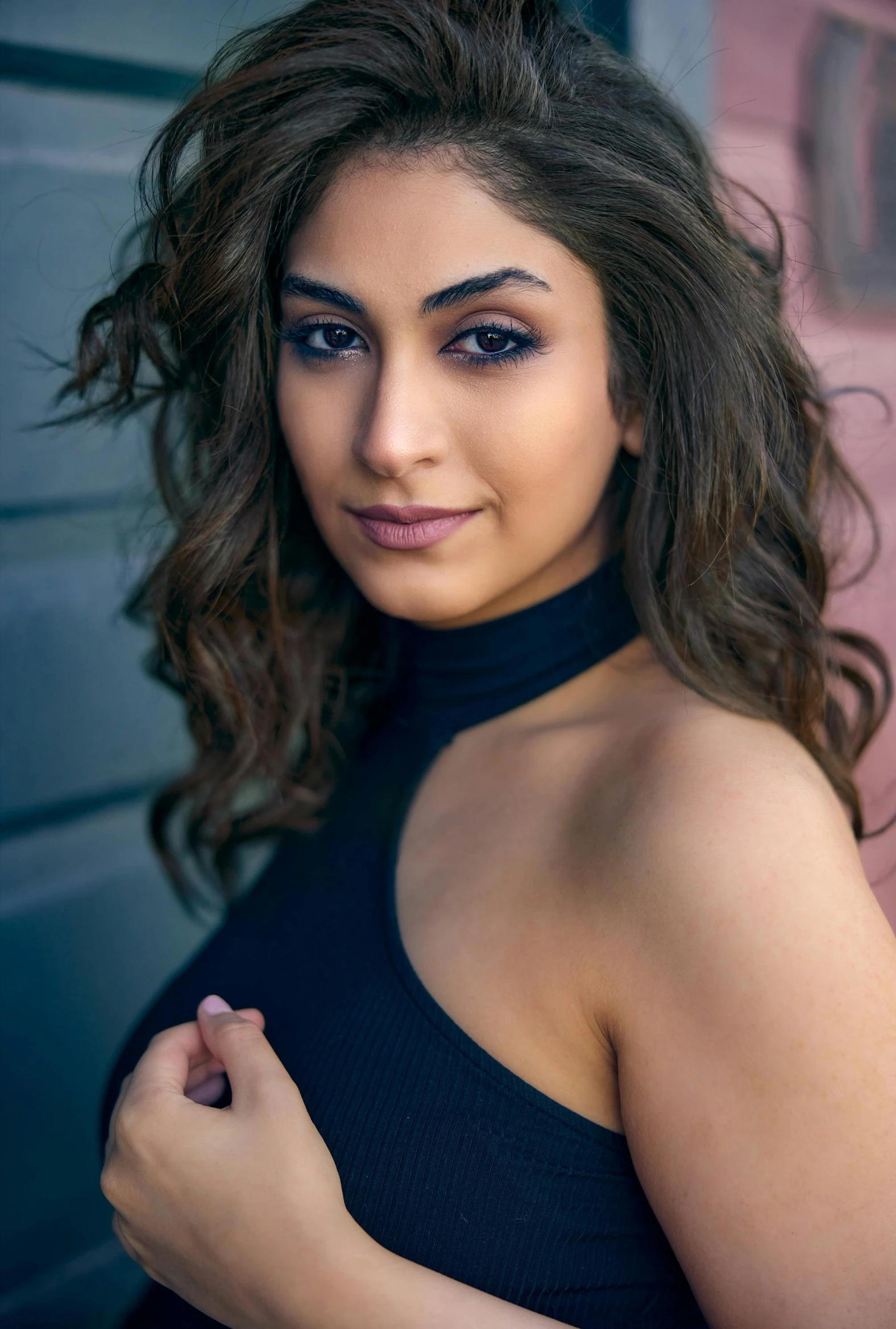 a woman in a black dress posing for a picture, an album cover, trending on pexels, arabesque, mia khalifa, fair olive skin, cinematic headshot portrait, beautifully soft lit