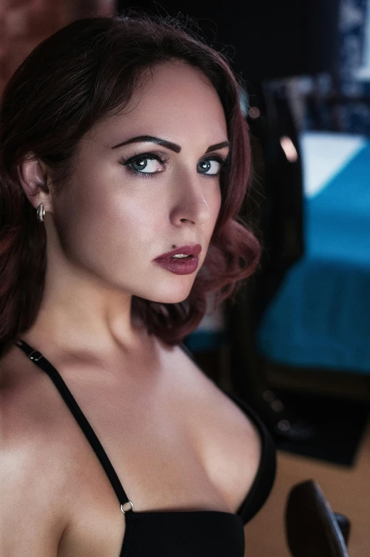 a woman in a black dress posing for a picture, a portrait, inspired by Elsa Bleda, reddit, bedroom eyes, pinup model, 5 0 0 px models, closeup!!!!!!