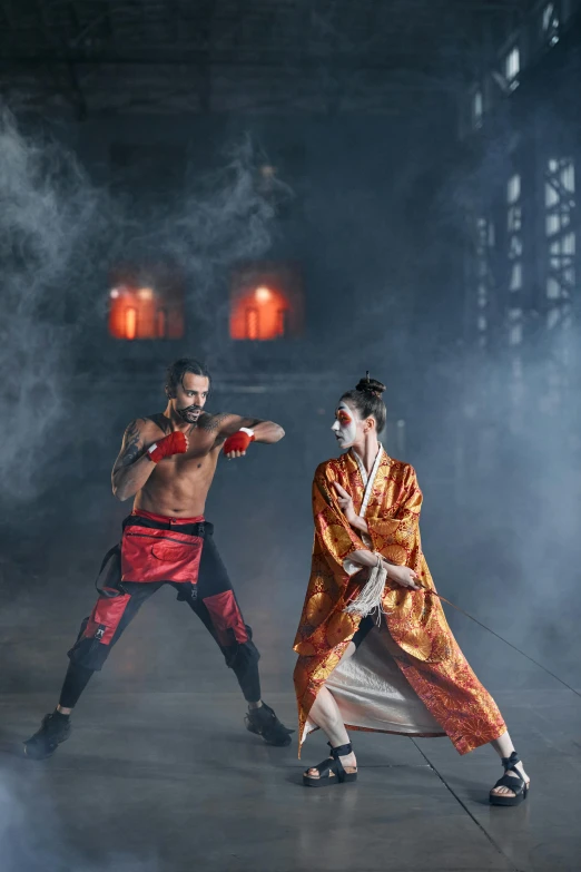 a couple of men standing next to each other on a stage, inspired by Ma Quan, pexels contest winner, arabesque, mai shiranui, getting ready to fight, fire & smoke, slide show