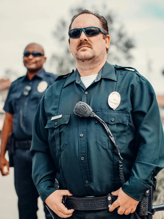 two police officers standing next to each other, unsplash, with glasses and goatee, roleplay, 3 - piece, wearing a general\'s uniform