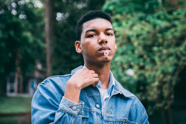 a young man with a cigarette in his mouth, unsplash, wearing a jeans jackets, in style of tyler mitchell, avatar image, alexis franklin