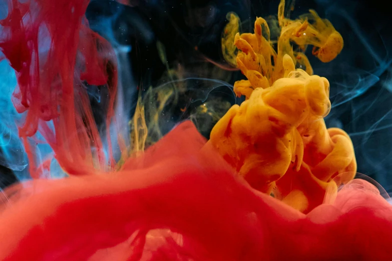 a close up of a red and yellow substance, inspired by Kim Keever, pexels contest winner, underwater ink, beeple and james jean, in colour, having a good time