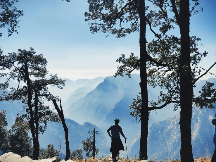 a group of people standing on top of a mountain, by Emma Andijewska, pexels contest winner, sumatraism, with matsu pine trees, uttarakhand, profile image, thumbnail