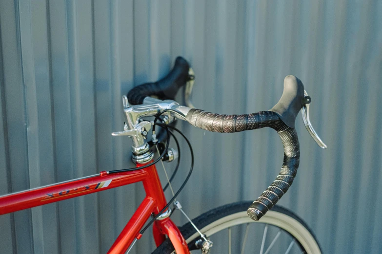 a close up of the handlebars of a bike, a portrait, unsplash, photorealism, wine-red and grey trim, bright ”, portrait n - 9, straps