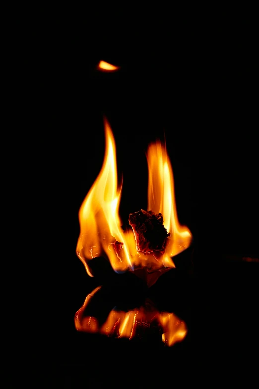 a close up of a lit candle in the dark, dancing around a fire, profile image, mat collishaw, avatar image