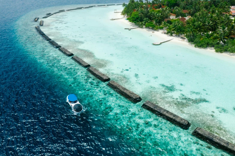 a small boat in the middle of a body of water, by Matthias Stom, pexels contest winner, hurufiyya, reefs, resort, 2000s photo