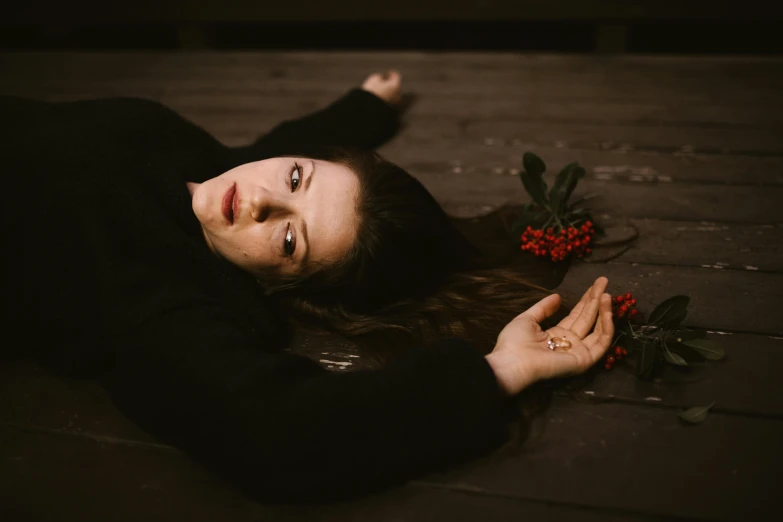 a woman laying on the floor with her eyes closed, a portrait, inspired by Elsa Bleda, pexels contest winner, renaissance, submerged in cranberries, 15081959 21121991 01012000 4k, outdoor photo, medium format. soft light