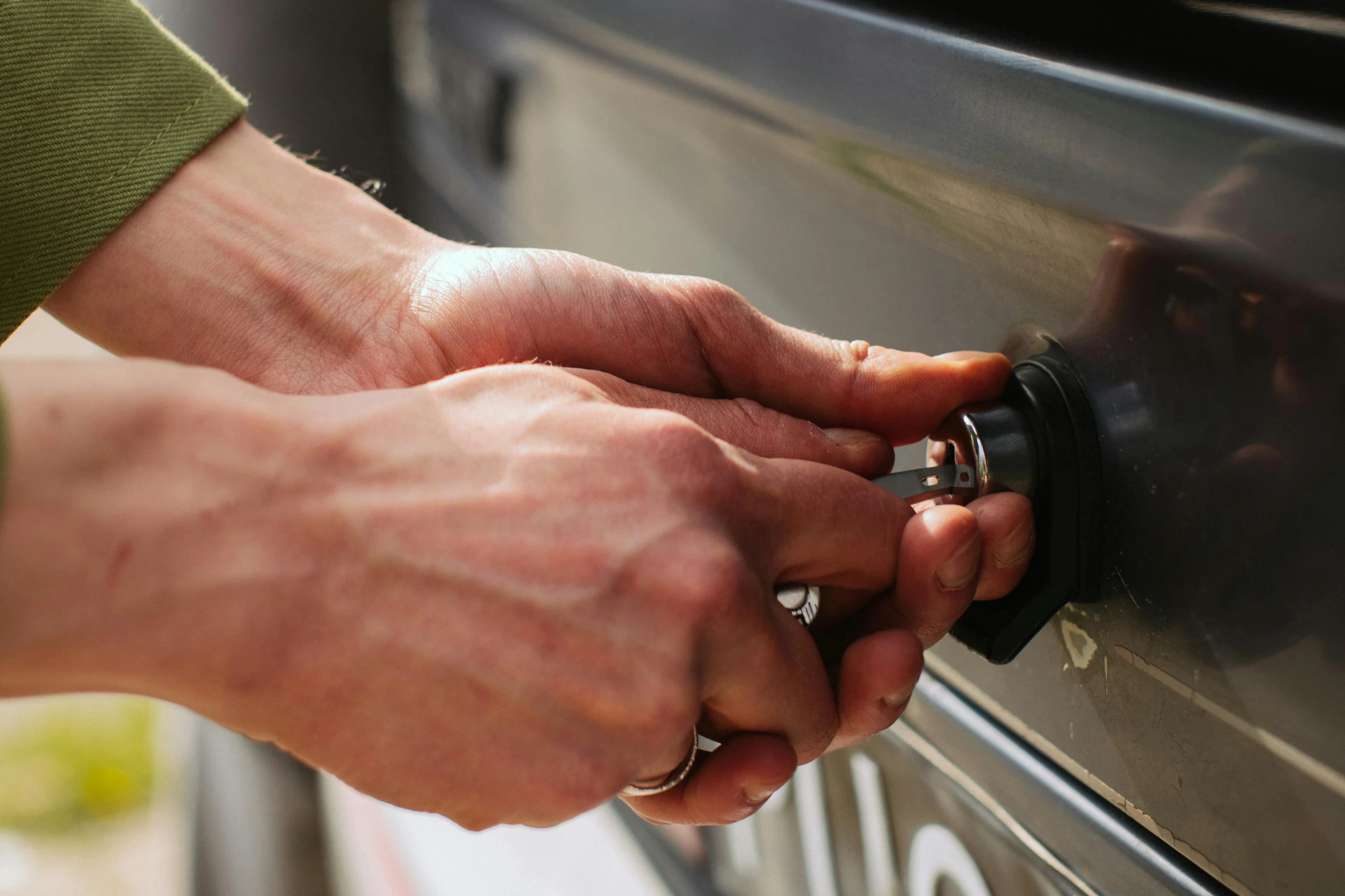 a close up of a person putting something in a oven, by Tom Bonson, auto-destructive art, hook as ring, road trip, press shot, elliot alderson