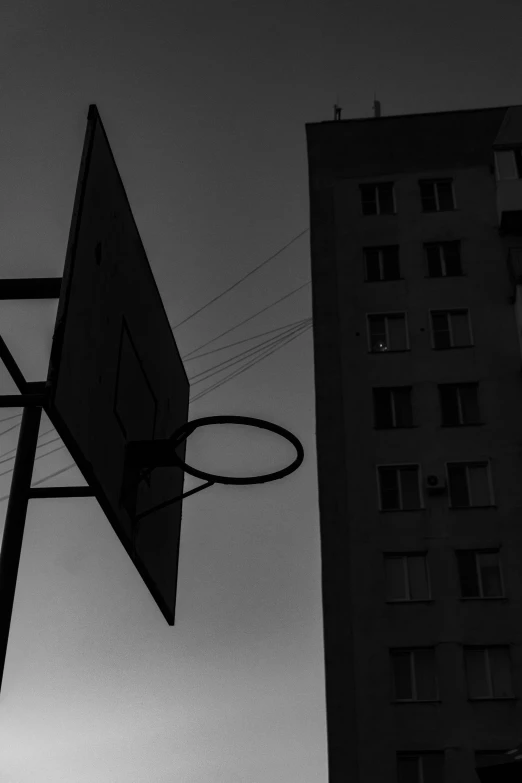 a black and white photo of a basketball hoop, a black and white photo, by Tamas Galambos, moscow, crepuscule, game aesthetic, in a square