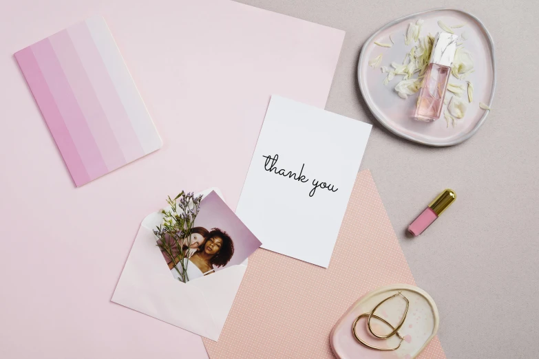 a thank card sitting on top of a pink table, a polaroid photo, inspired by Louis Hersent, violet colour palette, zendaya, rose quartz, nathalie emmanuel